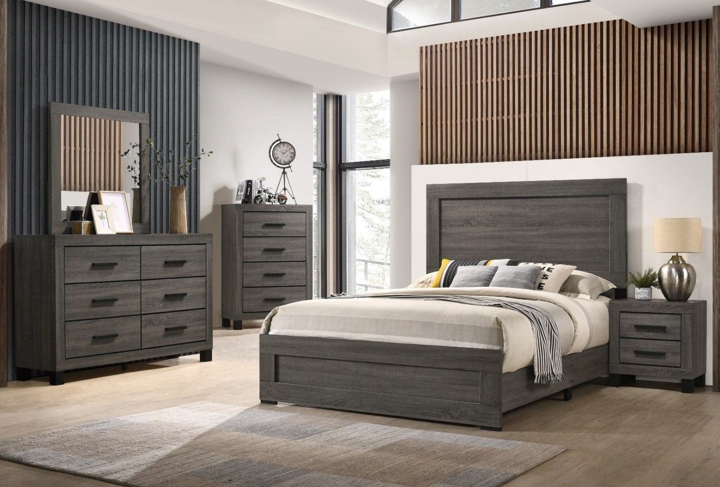 A full view of the modern bedroom set, featuring the queen panel bed, dresser with mirror, chest, and nightstand in a sophisticated weathered gray finish, set within a well-appointed room.