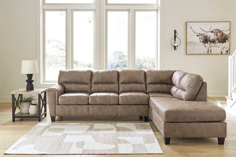 Angled lifestyle view of a matching sectional sofa with a right-hand facing chaise, showcasing the same contemporary design and upholstery in a larger configuration.