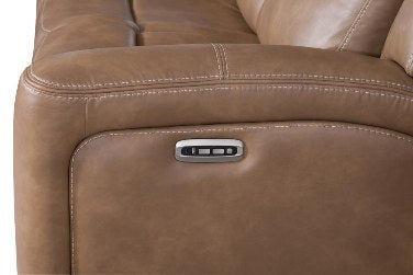 Close-up of the armrest, highlighting the discreet metal power recline control panel with three buttons and the stylish contrast stitching on the mocha leather-look upholstery.