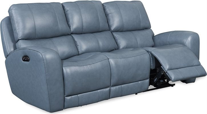 Front-angle view of the matching blue-gray leather power reclining sofa with one recliner partially extended.