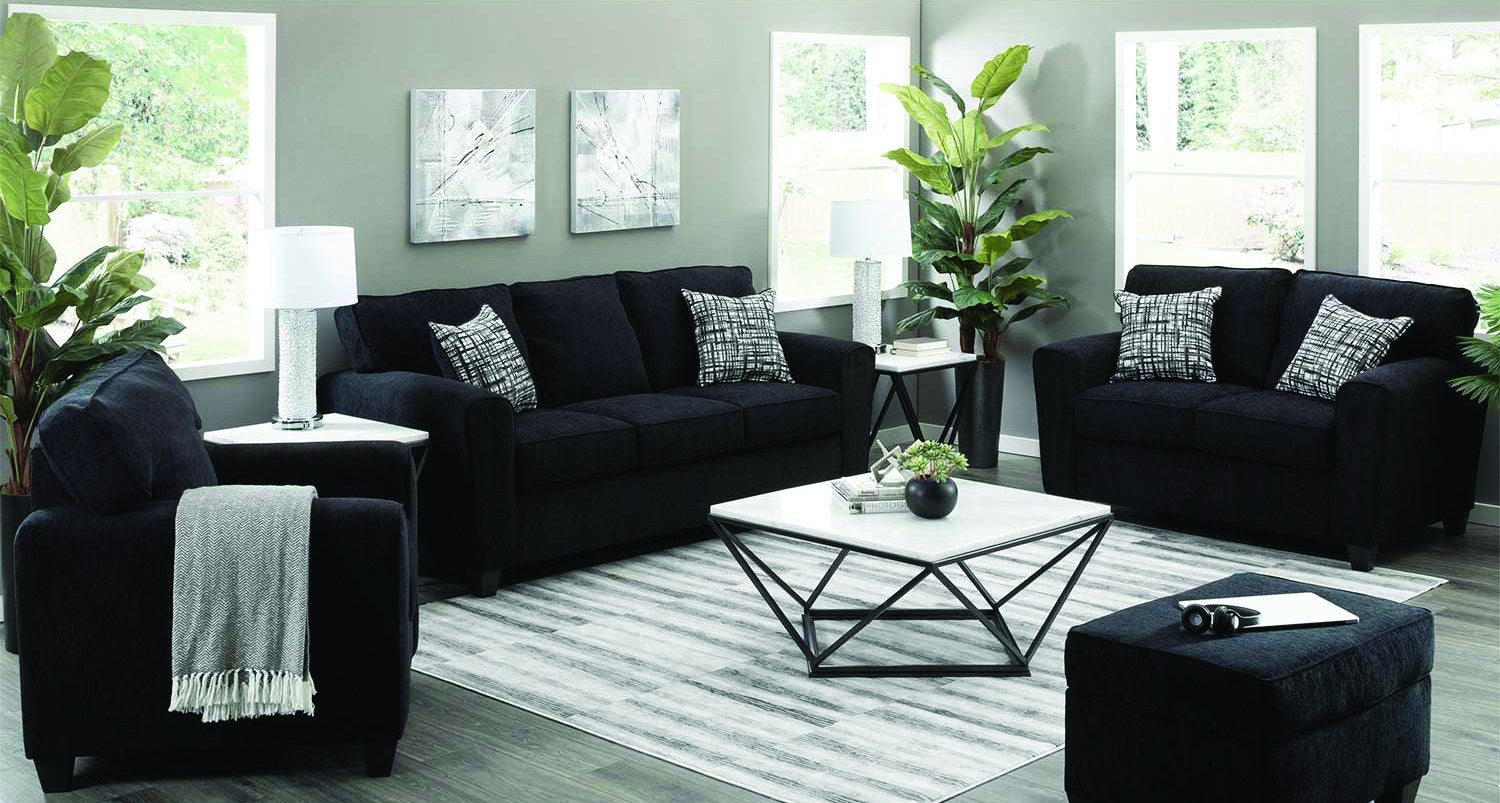 Main product shot of the sofa, highlighting its clean lines, dark fabric upholstery, and included throw pillows.