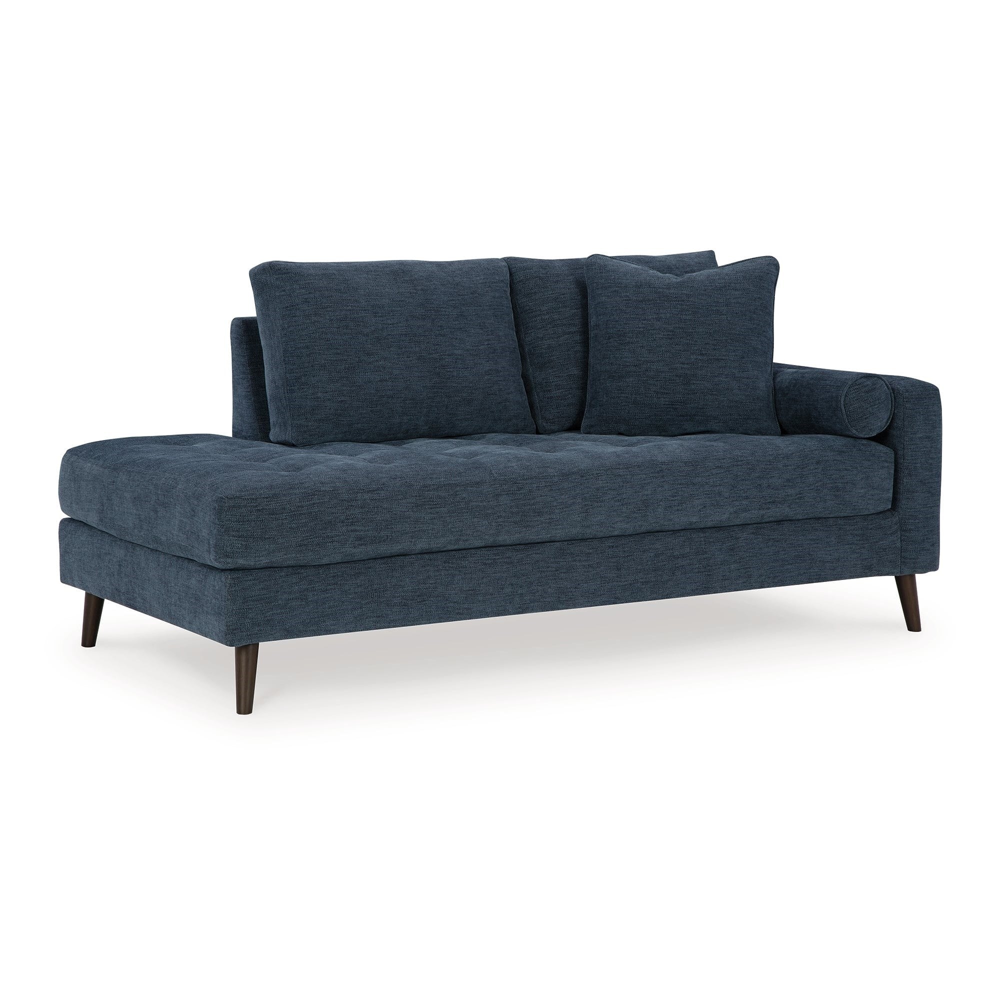 Front-angled view of the Ashley Chaise Lounge in a rich blue textured fabric, featuring elegant button tufting and slender dark tapered legs, isolated on a pristine white background.