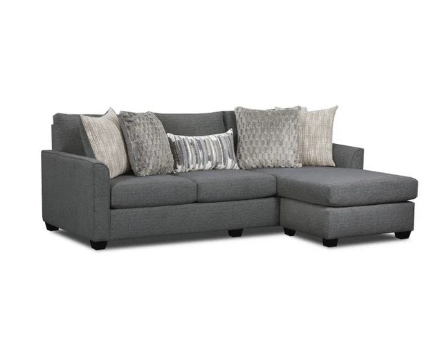 Full front view of the gray fabric sofa chaise, showcasing its complete length and throw pillows.