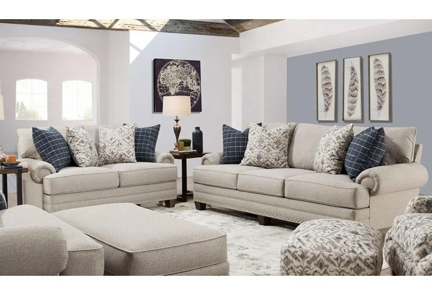 Full, inviting view of the Franklin 91620 Loveseat, showcasing its classic rolled arms and plush cushions, accented with decorative throw pillows.