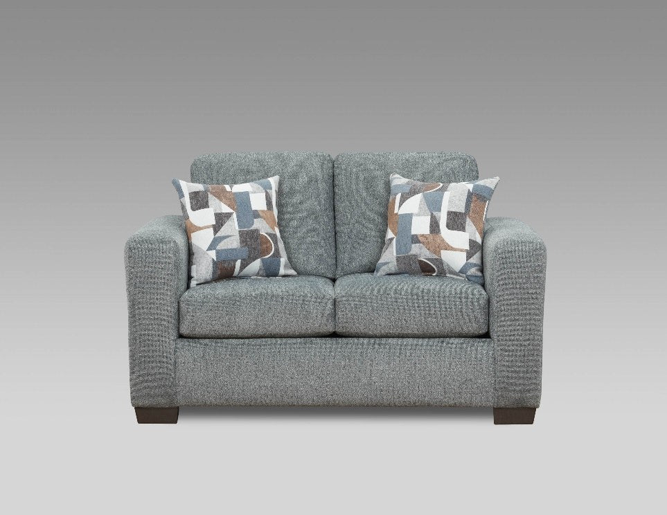 Full front view of the loveseat, showcasing its textured gray fabric and patterned throw pillows.