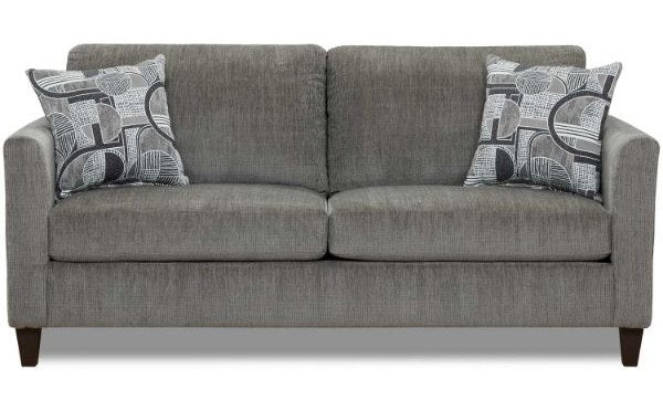 Close-up of the left armrest and an abstract patterned throw pillow, highlighting the sofa's style and fabric texture.
