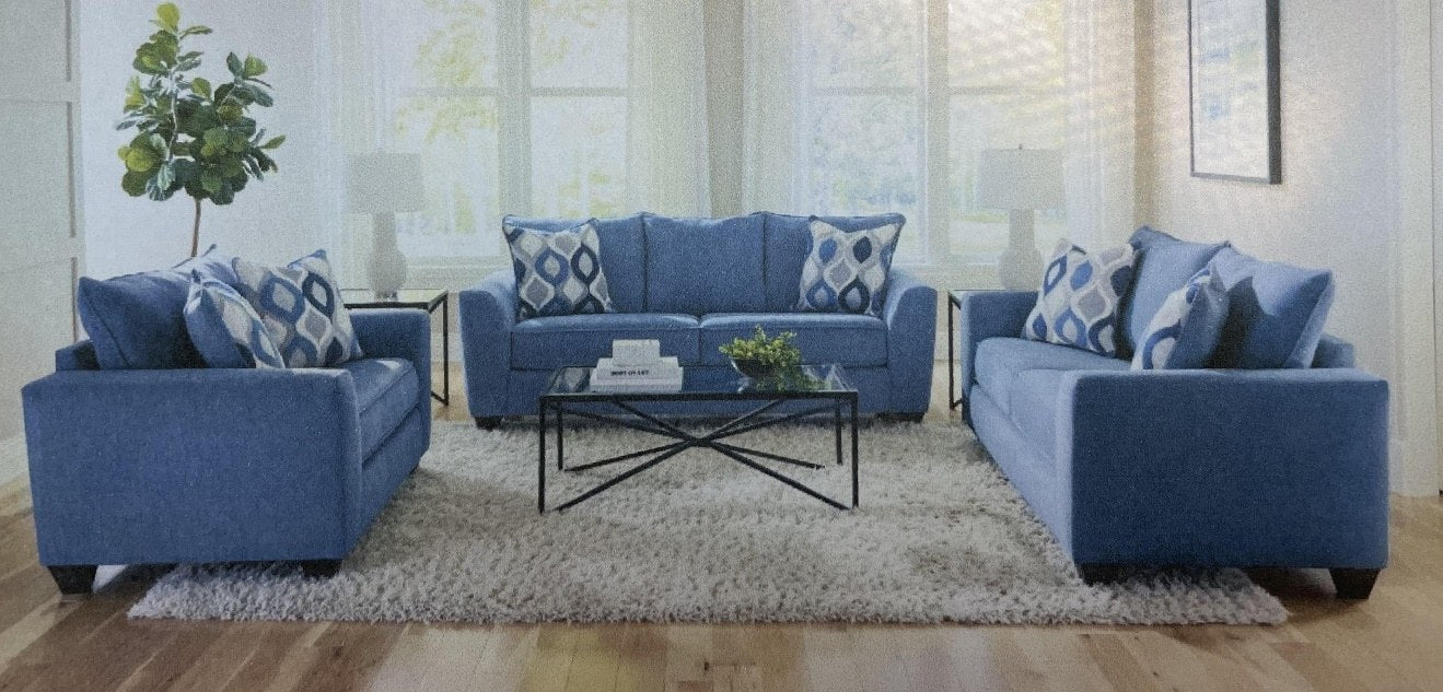 A complete living room set, including the Albany OTTO sofa, loveseat, and armchair, displayed in a modern, well-lit room setting with a coffee table, rug, and decorative plant.